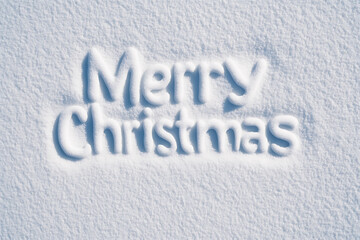A greeting message written into a snow-covered surface, wishing well-being during the holiday season.