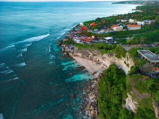 Breathtaking summer aerial view of Suluban Beach, Bali coastline and bustling resorts