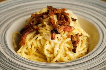 Traditional spaghetti carbonara with crispy pancetta