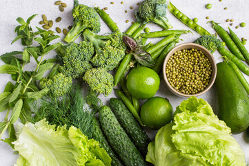 Fresh green vegetables in assortment top view. Healthy lifestyle, detox, flat lay, horizontal.