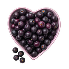 Acai berries in heart-shaped bowl on white background