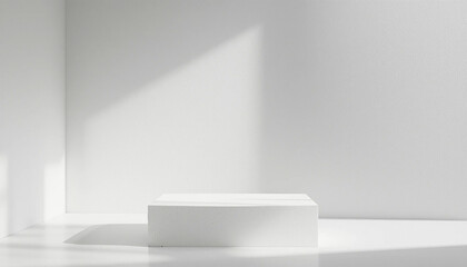 Minimalist white product display pedestal showcasing a clean design aesthetic ideal for showcasing cosmetics, jewelry, or other small items against a sunlit white wall background.