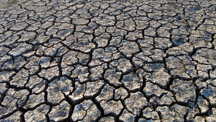 broken and cracked lands caused by drought, lands split open by thirst,