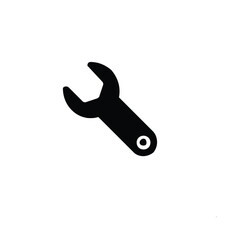 Close-up of a metal wrench in hand, an isolated construction tool with a black plastic handle