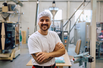 Portrait of food factory worker looking at camera.