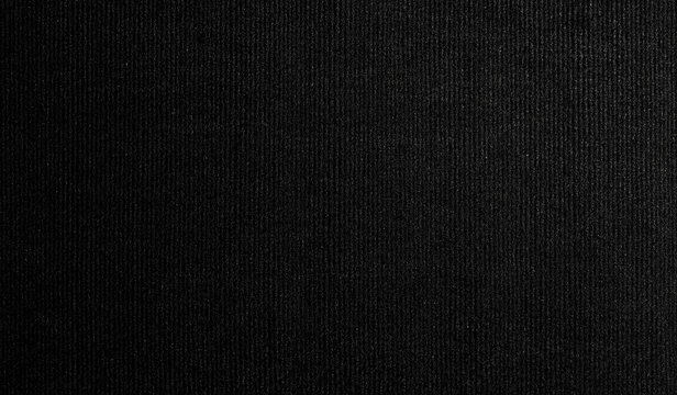 A high-resolution image of black felt fabric with a flat surface, showcasing its smooth and soft texture. The fabric is seamlessly captured, offering a seamless pattern perfect for design projects 
