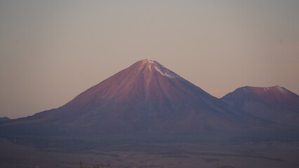 Drone footage over San Pedro de Atacama, Chile, showcasing desert landscapes, volcanoes, and surreal twilight skies in the world's driest desert