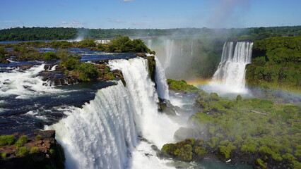 Stunning views of Iguazu Falls captured from various angles, showcasing the immense power, mist, and natural beauty of this iconic South American wonder