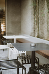 Empty coffee table over defocused coffee shop background with copy space.

