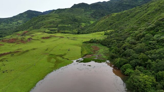  Remote lagoon surrounded by forest and highlands in the rural landscape of Ng&auml;be-Bugl&eacute;, Panama