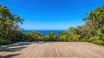Wooden deck overlooking ocean and lush tropical foliage.