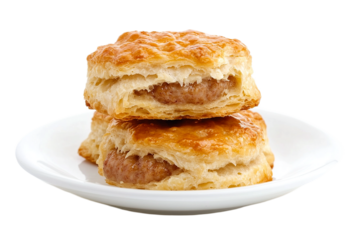 Golden biscuit sandwiching a sausage patty isolated on white background or png background or transparent background.