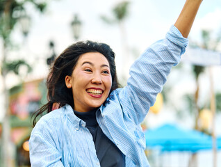 Portrait of a young woman girl running and waving in a rush , catching a taxi cab or meeting a...