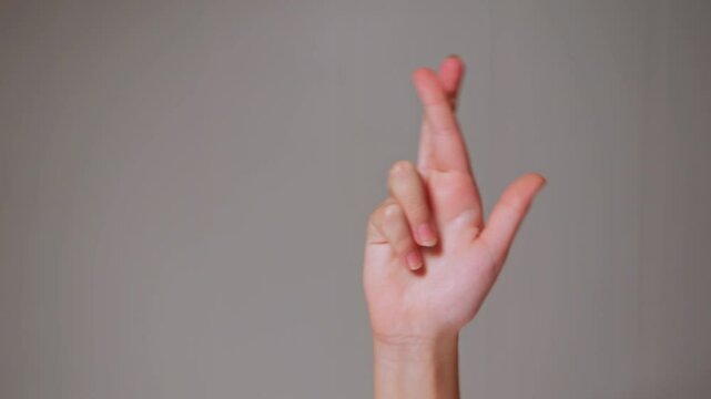 Close-up of young girl&rsquo;s hands showing simple everyday gestures on white background