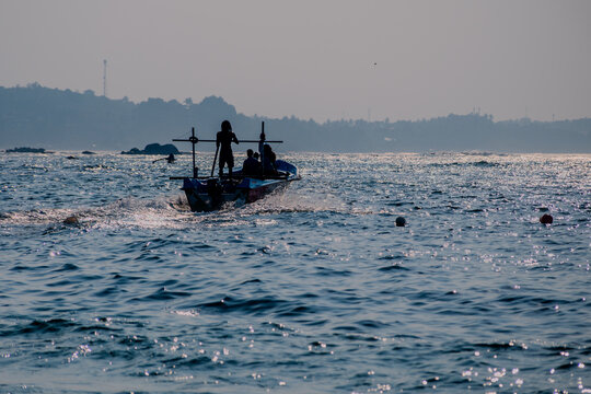 Silhouetted Fishing Boat on the Ocean at Sunset near Polhena Beach, Matara, Sri Lanka captured with Nikon D7500