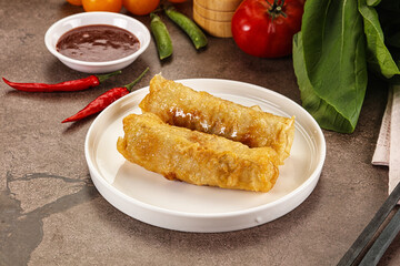 Vietnamese stuffed spring roll served sauce