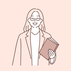Smiling woman with glasses holds a book and wears a blazer in a simple design