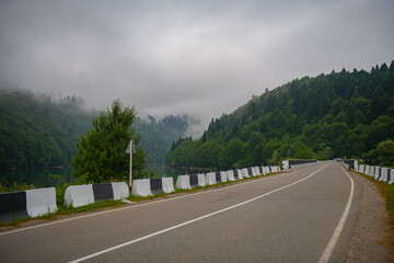 A car-free road in the morning in the fog in Georgia