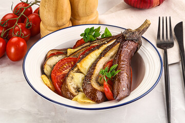 Baked tomato with mozzarella and tomato