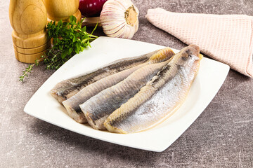 Marinated salted herring fillet apetizer