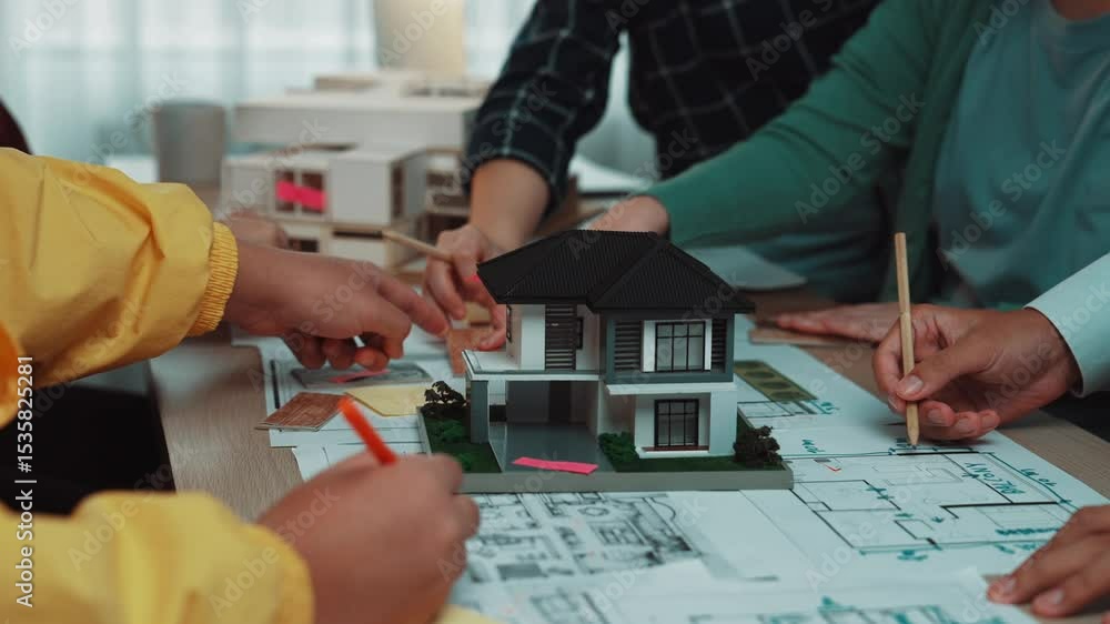 Aufkleber a group of professionals collaborates on architectural planning using miniature models and detailed 