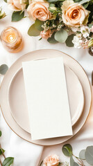 A top-down view of an elegant dinner setting with a blank embossed menu card on a refined ceramic plate, paired with a pristine linen napkin for a touch of sophistication.