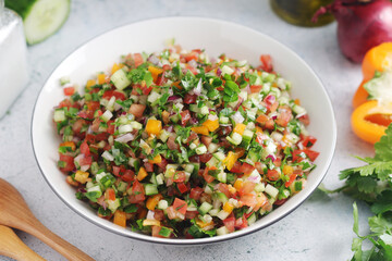 A bowl with traditional Israeli Salad