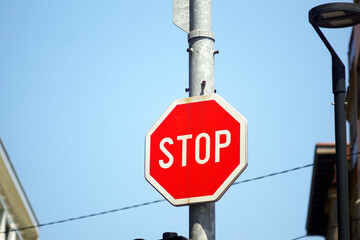 Traffic control for the safety of passengers, drivers and pedestrians: a close-up of a red...