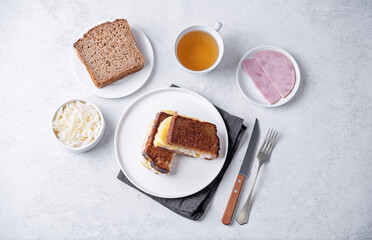 Ham cabbage cheese rye roasted sandwich in a plate