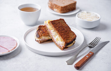 Ham cabbage cheese rye roasted sandwich in a plate