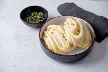 Asian scallion buns in a bowl