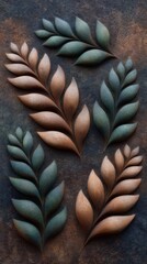 Textured leaves in earthy tones arranged artistically on a dark background