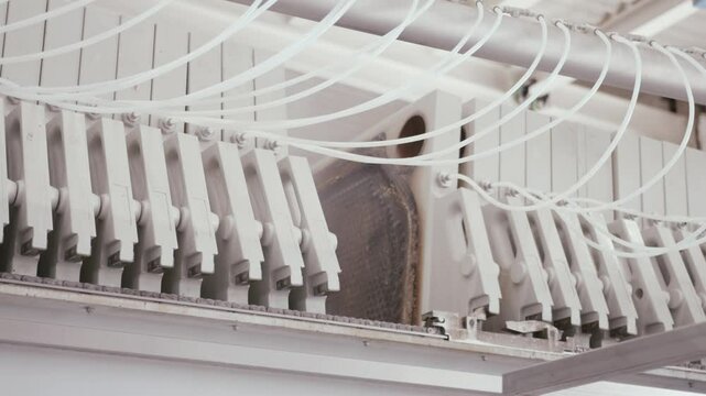 Filter press plates are closing, initiating the filtration process in a beverage production facility, showcasing the advanced technology employed in modern beverage manufacturing