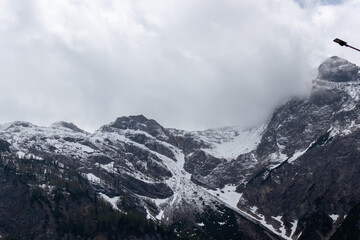 A dramatic and awe-inspiring view of the towering Austrian Alps, captured from the renowned...