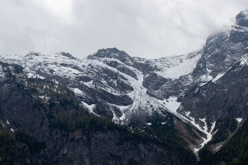 A dramatic and awe-inspiring view of the towering Austrian Alps, captured from the renowned...