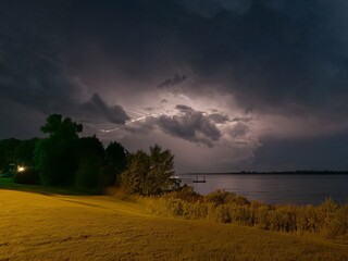 storm clouds over the river with lightning