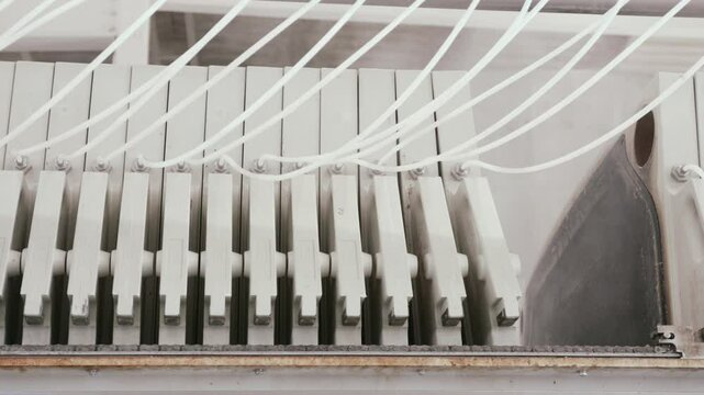 Industrial filter press plates gradually closing. Effectively separating liquid and solid materials during precision manufacturing filtration process within advanced industrial production environment