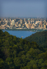 Landscape view at big city from green hills