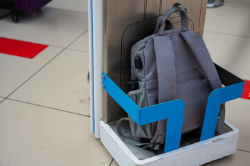 Metal frame control at the airport terminal. Checking the size of hand luggage at the airport.