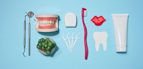 Set of oral hygiene products and tools, tube of toothpaste, toothbrush, dental floss, dental...