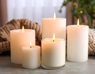 Burning candles creating cozy atmosphere on table