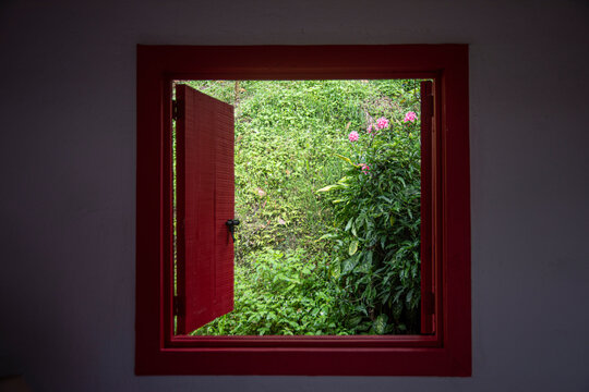 Red open window in Colombian coffee house,  axis of the coffee triangle
