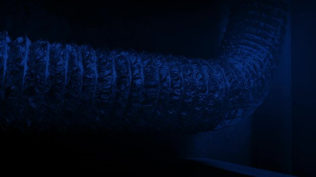 Large Ventilation Pipe In Dark Area
