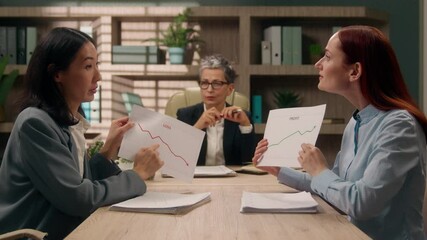 Excited multiethnic team discussing talking Caucasian Asian women females in office business diversity businesswomen showing charts graphs discuss financial project coworkers strategy plan briefing - Powered by Adobe