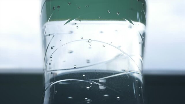 Closeup Blurred Shooting with Bubbles from a Botle with Accidulated Sweet and Fresh Drink.