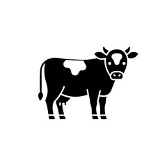 Fototapeta premium Black silhouette of a cow standing on a white background 