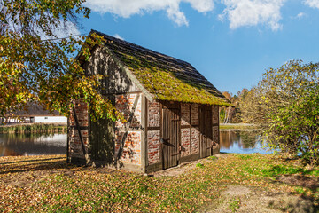 Small farm building. Old brick barn for storing tools and equipment