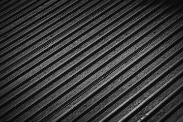 Black background. Abstract dark texture with diagonal lines