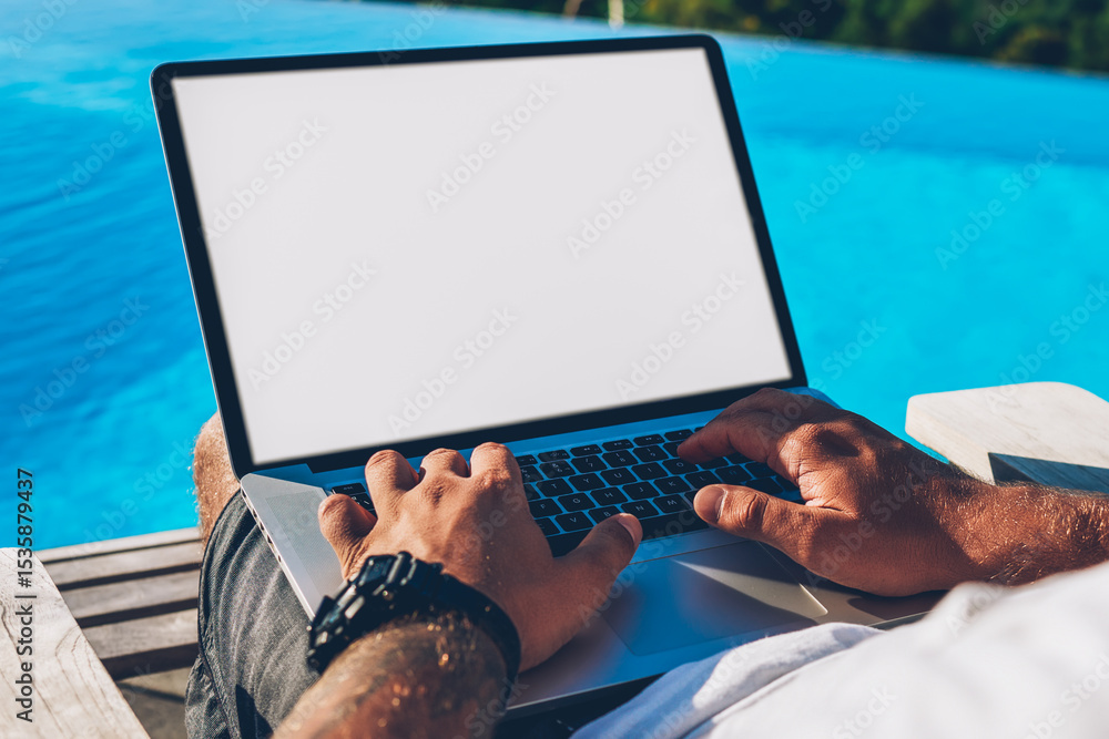Poster cropped image of male hands typing text information on keyboard of modern laptop computer with blank