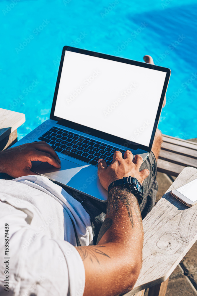 Poster top view of male freelancer searching information on internet websites and working at modern netbook